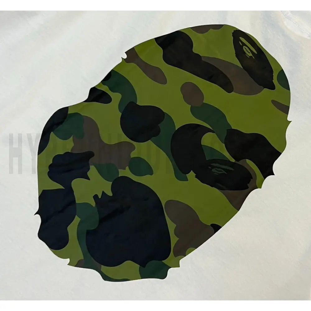 Detailed shot capturing the graphic print on the white tee's back panel.