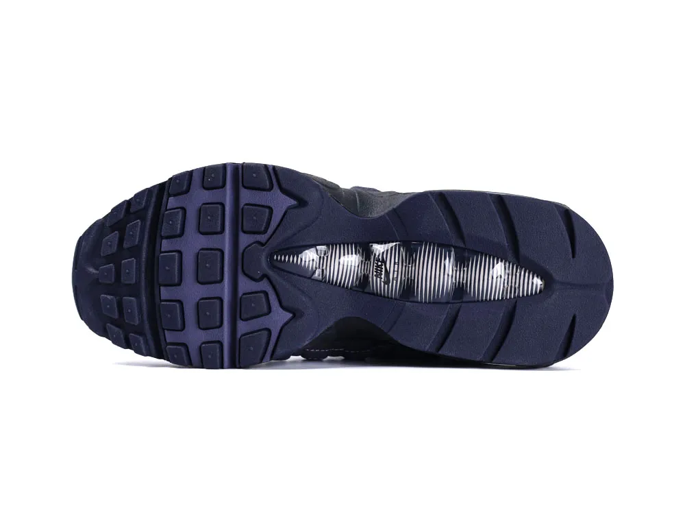 Dark blue rubber sneaker sole with textured grip and transparent midsection detail.