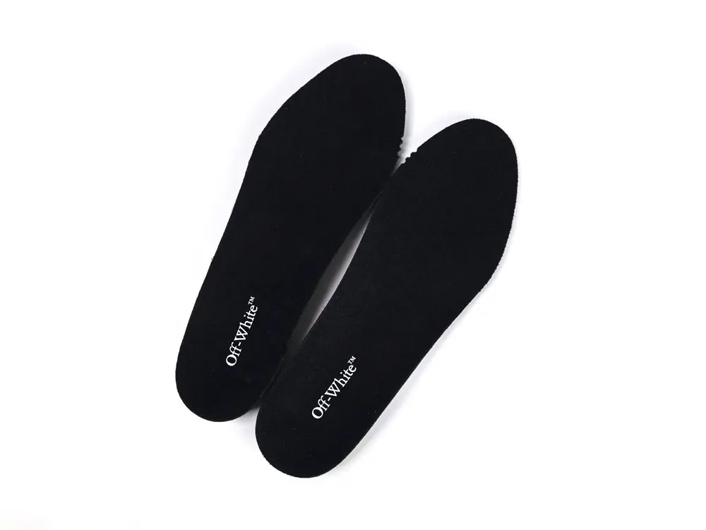 Pair of black insoles with printed branding, shown removed from the trainers