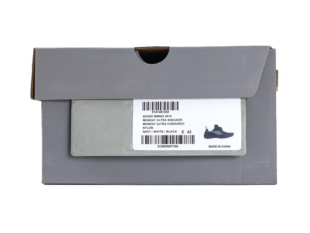 Gray shoe box with label; navy, white, black sneakers inside, nylon material.