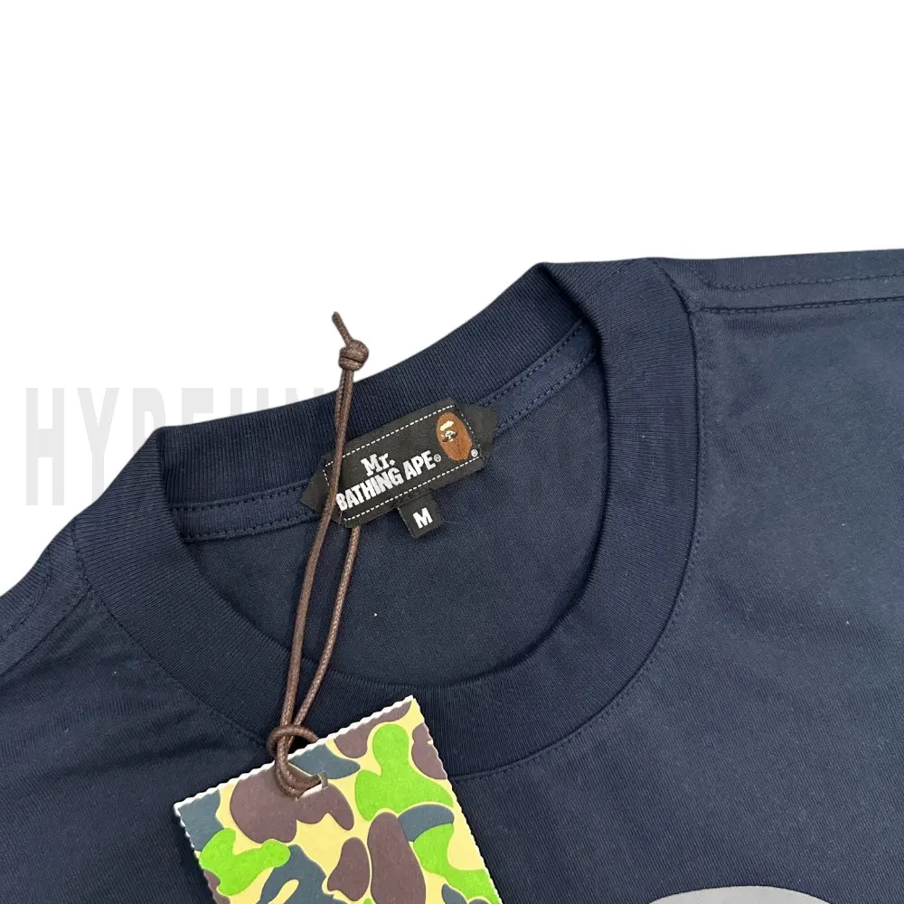 Neckline tag close-up, displaying garment care symbols and brand information with fashion-forward presentation.