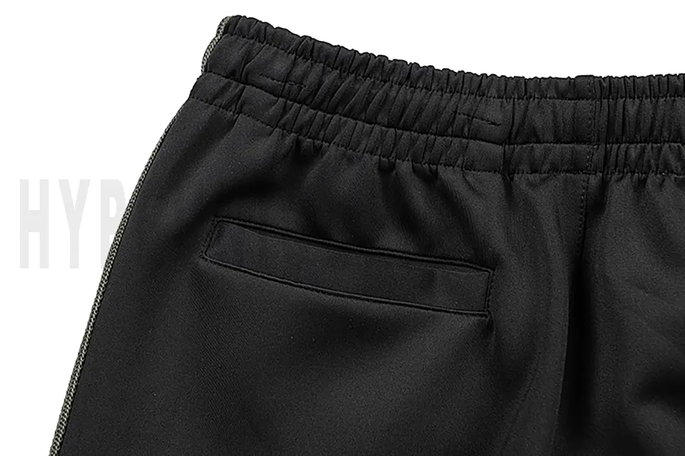Detail of the back pocket on the track pants.