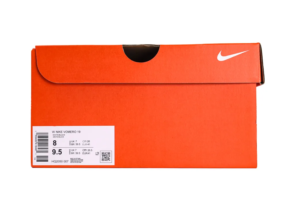 Orange cardboard shoe box with white branding and label on the side.