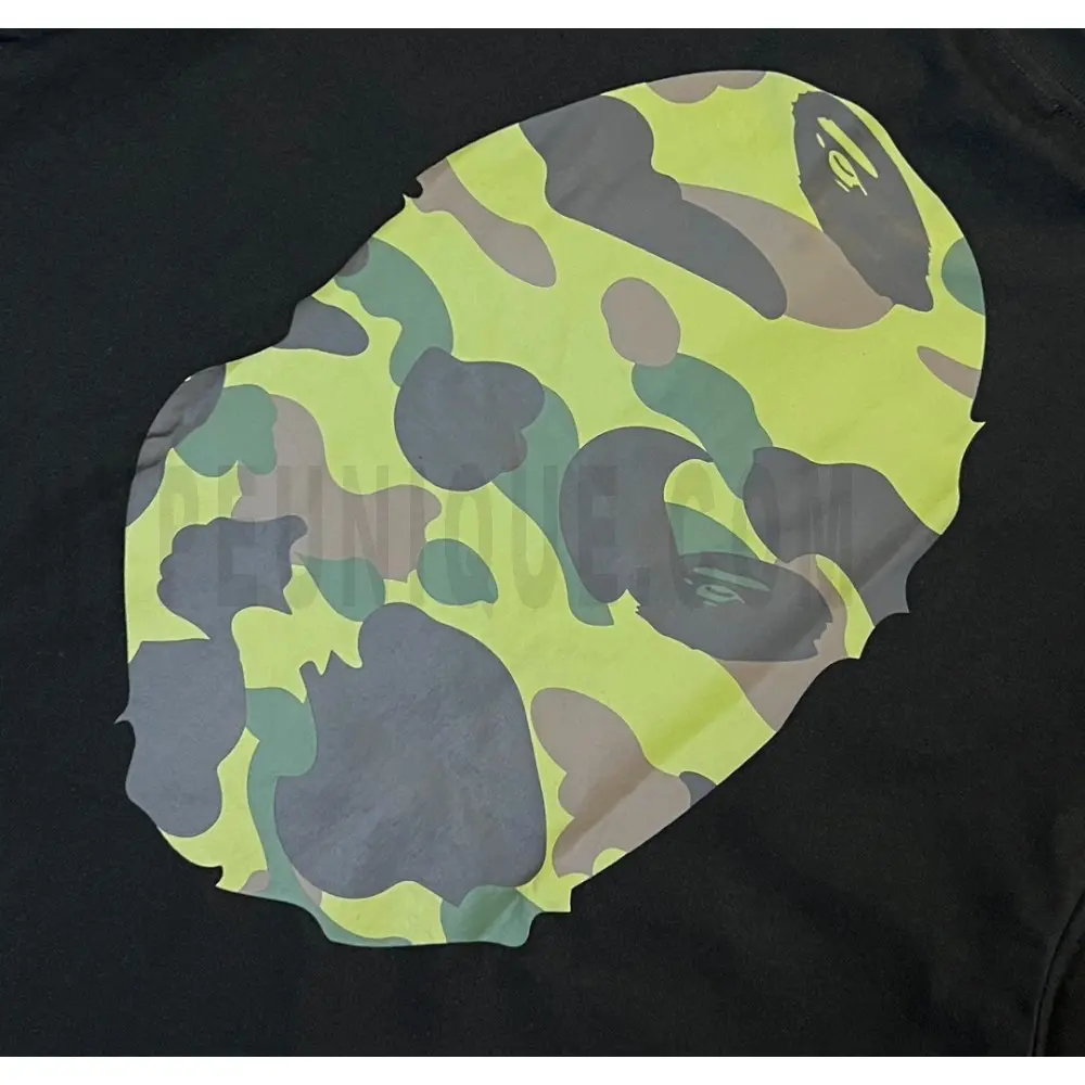 Detailed shot capturing the graphic print on the black tee's back panel.
