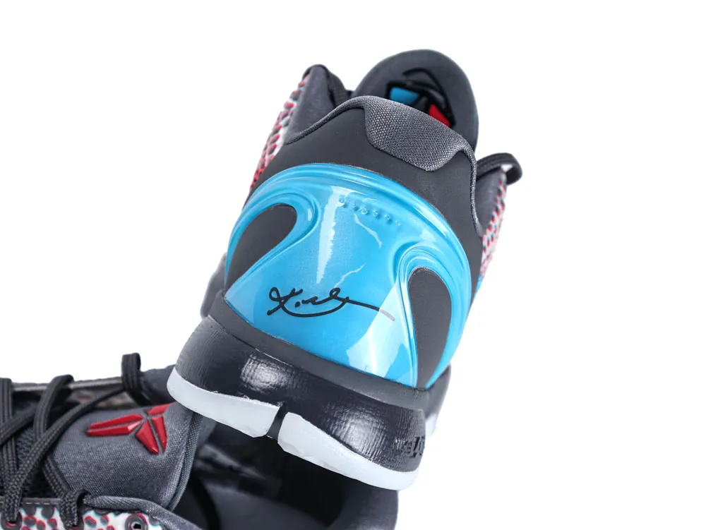 Black and blue sneaker with synthetic upper and signature detail on heel.