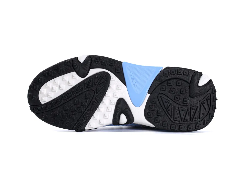 Sneaker sole featuring black, white, and blue rubber with textured grip pattern.
