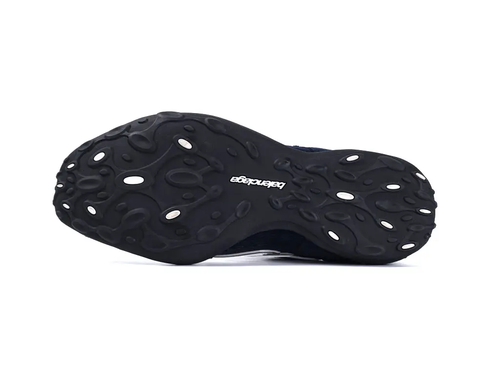 Black rubber shoe sole with textured design and manufacturer's logo in white.