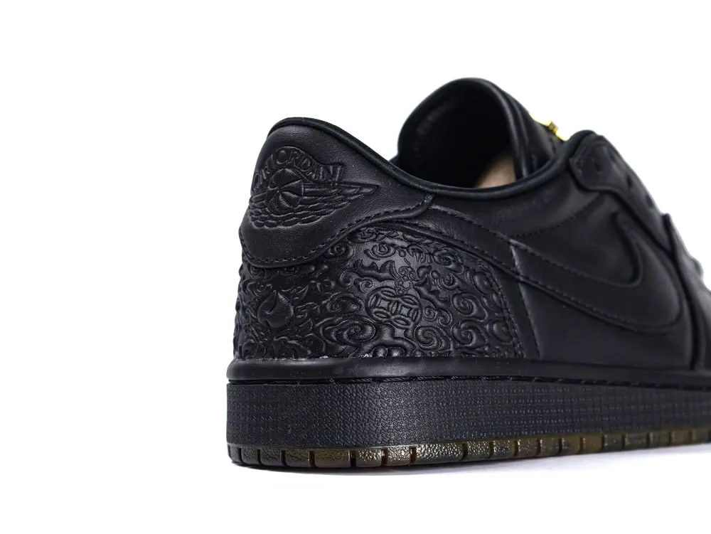 Black leather sneaker heel with embossed pattern and textured rubber sole.