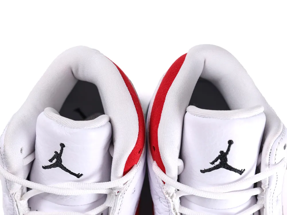 White and red sneakers with leather uppers, featuring black logo on tongues.