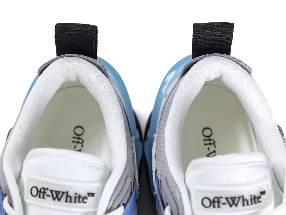 Blue and gray sneakers with white fabric interior and black pull tabs.