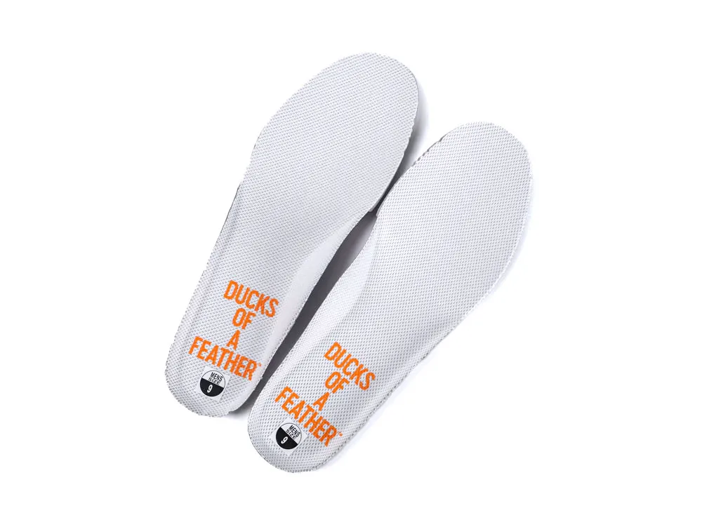 White textured insoles with orange text, "DUCKS OF A FEATHER."