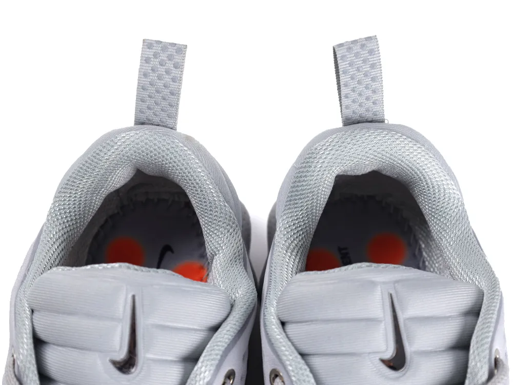 Gray sports shoes with fabric lining, close-up of heels and pull tabs.