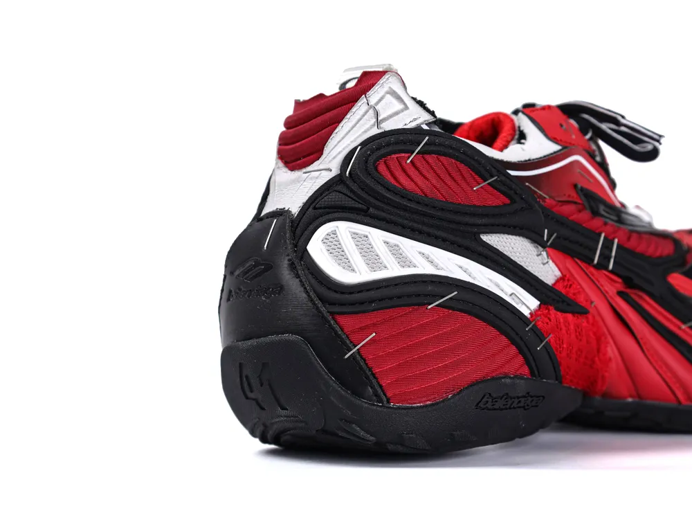 Red and black sneaker with textured fabric and synthetic leather details.
