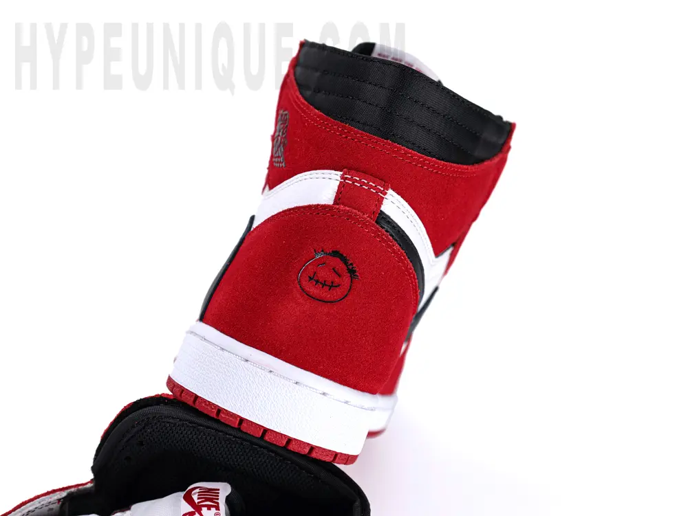A close-up of the toe box, showing the red Mudguard and white toe box.