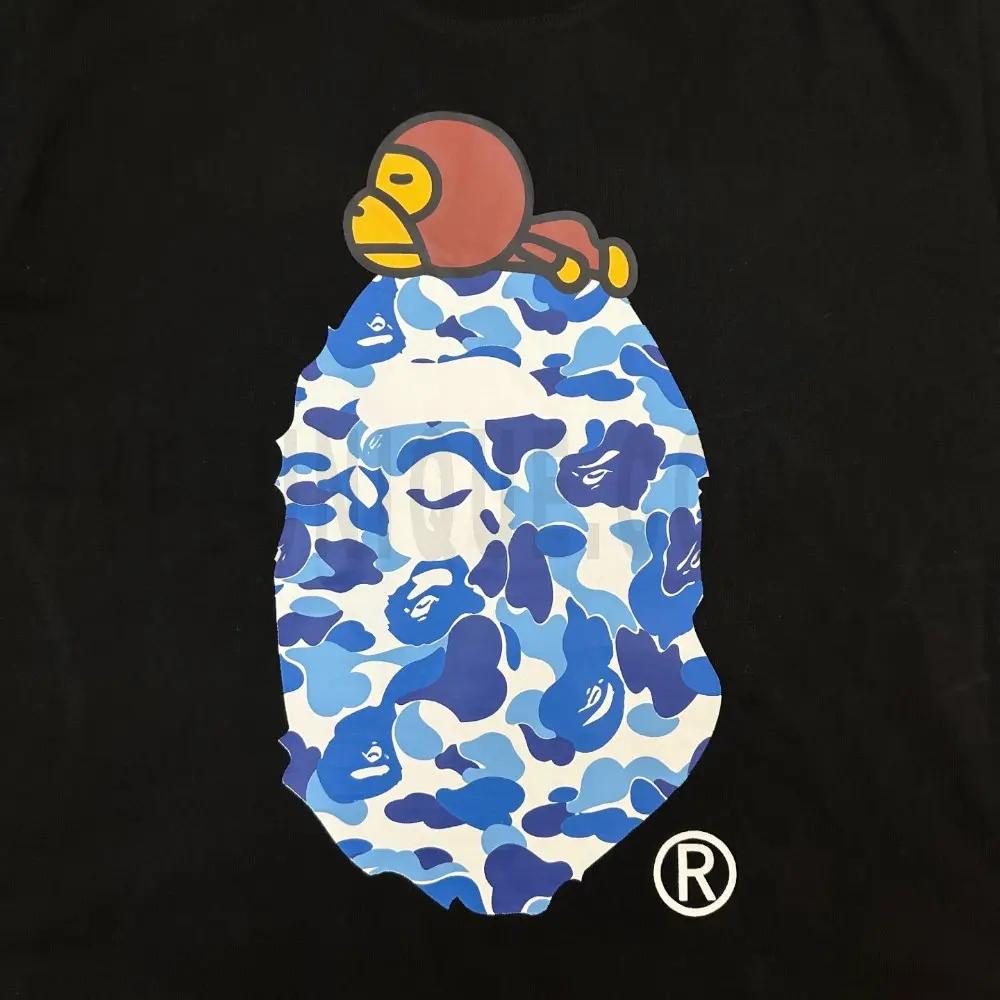 Detailed shot capturing the graphic print on the black tee's front panel.