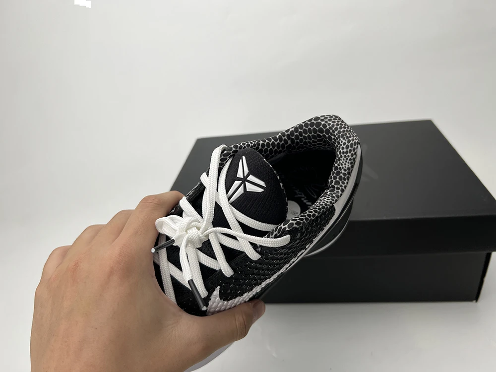A front view of the tongue and collar of the Kobe 6 Protro ‘Mambacita Sweet Sixteen,’ showcasing the signature Kobe logo and the black-gray cotton collar