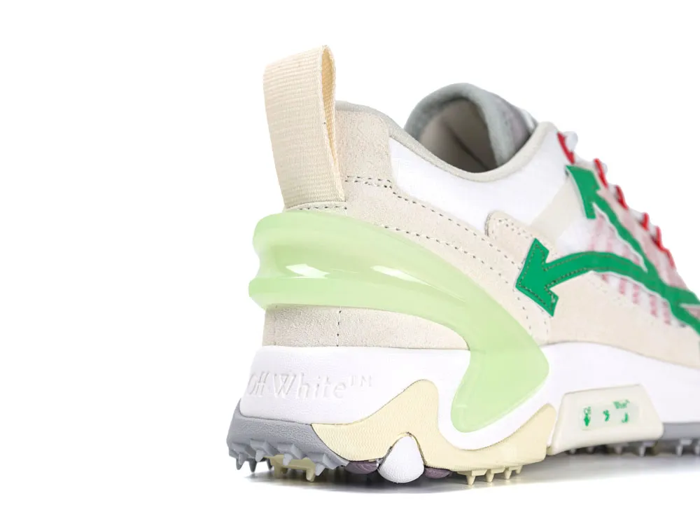 Sneaker back view featuring beige suede and green accents with rubber sole details.