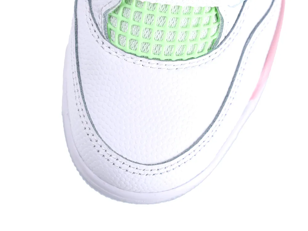 Overhead view of the white tumbled leather toe box and mint green mesh on the Jordan 4.