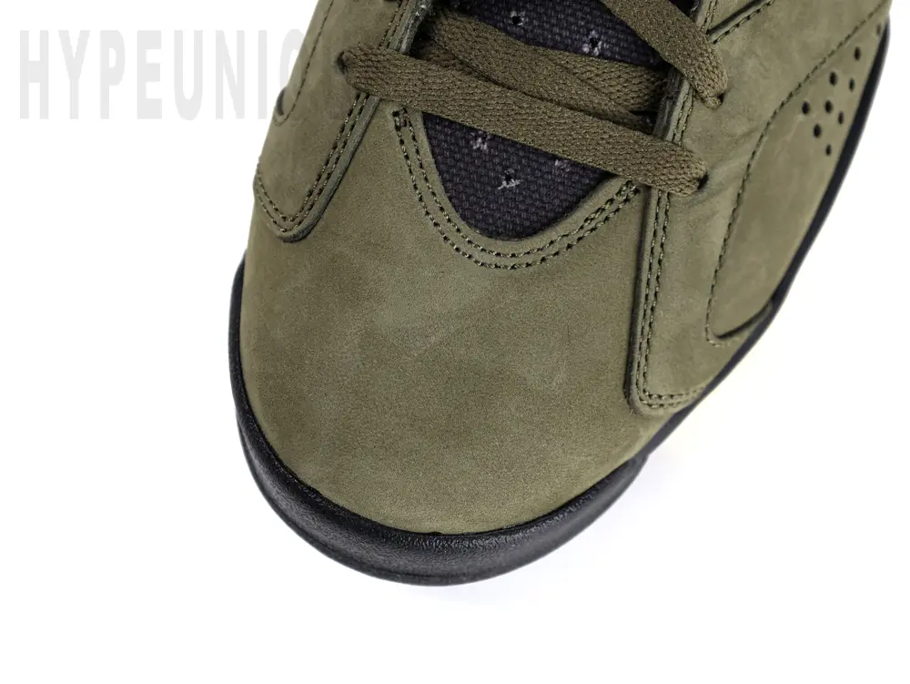 A close-up look at the Travis Scott x Air Jordan 6 Retro 'Olive' Reps suede toe cap.