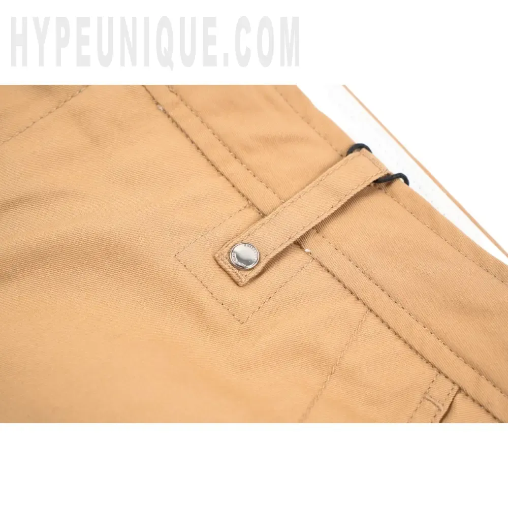 Close-up of button detail on the clothes
