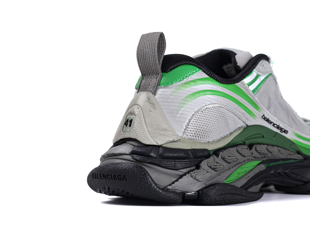 Silver and green mesh sneaker with black sole and fabric heel loop.