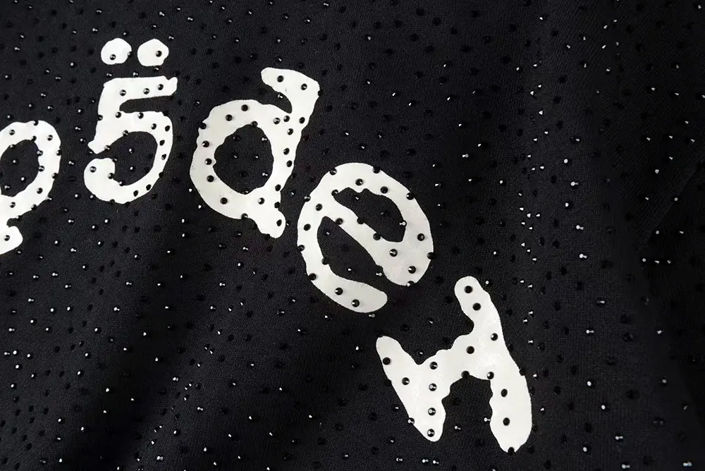 A close-up of the chest logo on the Sp5der VVS Hoodie in Black, showcasing the flawless rhinestone craftsmanship.