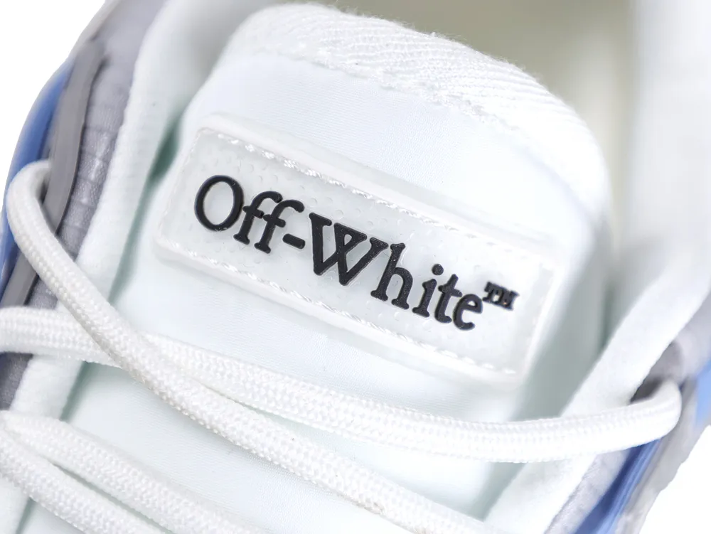 White and gray fabric sneakers with logo on the tongue.
