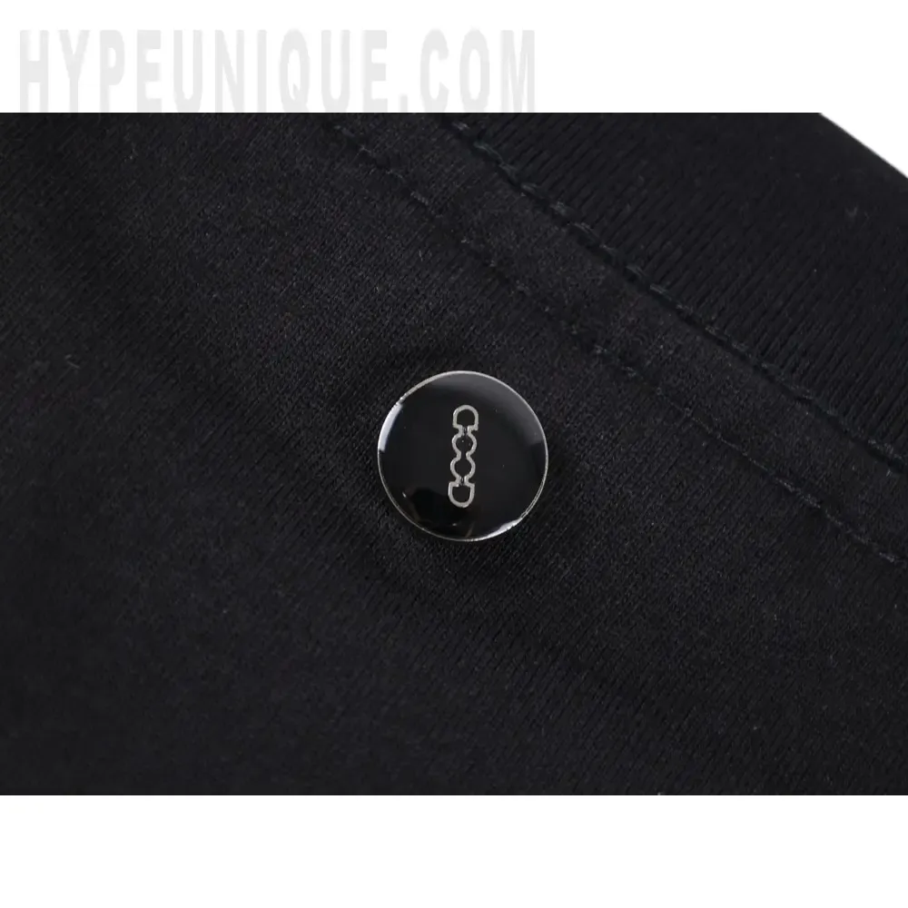 Close-up of button detail on the clothes