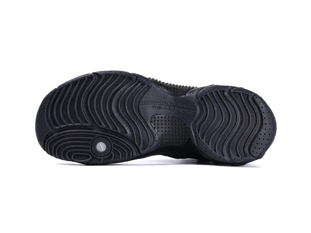 Black rubber sneaker sole with textured grip pattern, showing intricate design details.