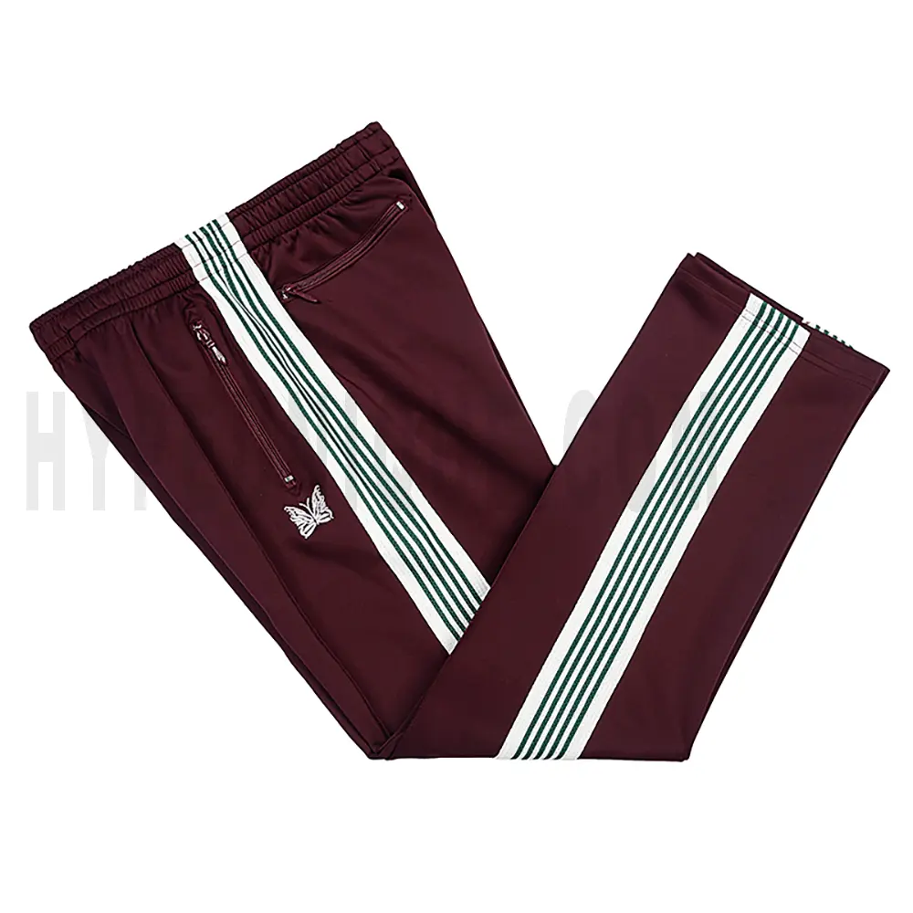 Side view of red track pants.