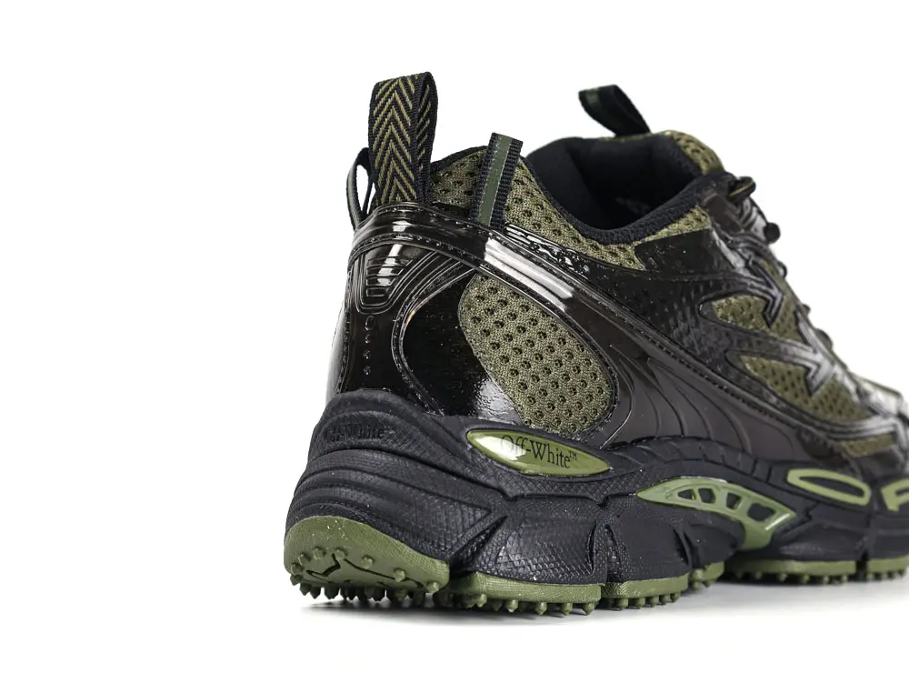 Rear angle view of Off-White Black Be Right Back trainer showing heel structure and pull tab detail